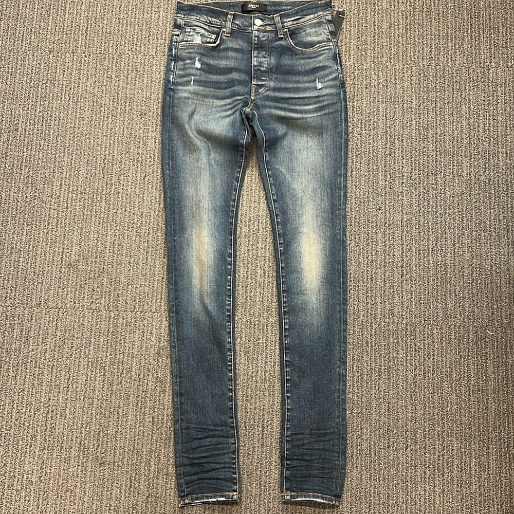 Amiri stack style skinny Jean.